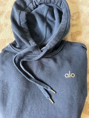 ALO Yoga Black Hoodie with Gold Logo